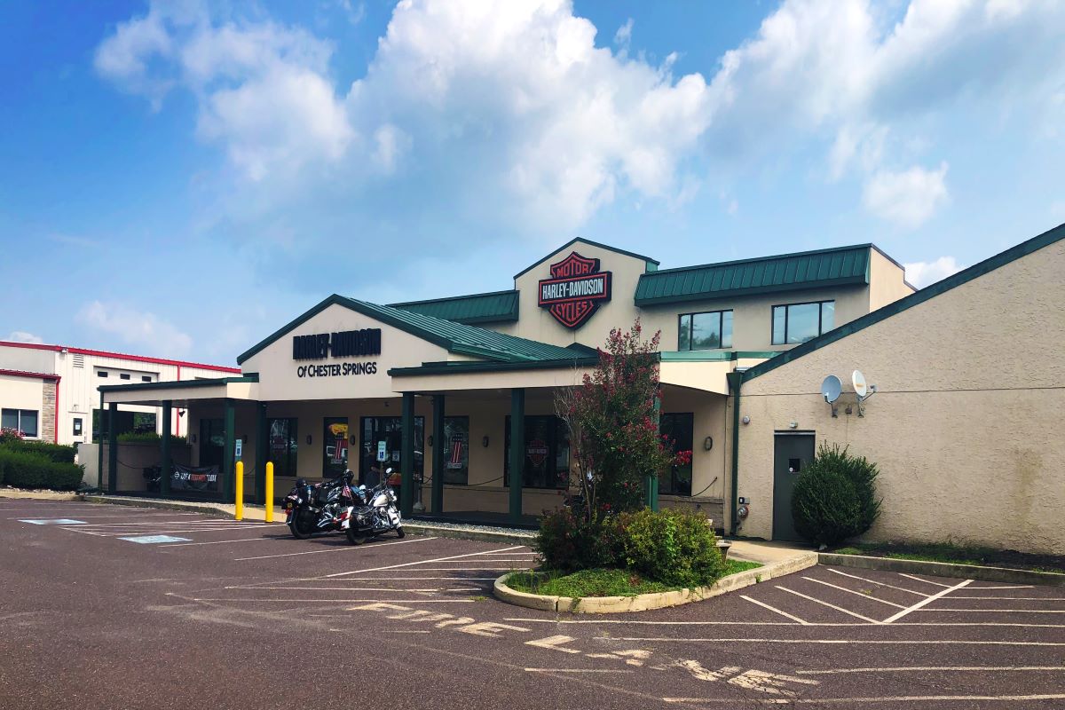 Brick building surrounded by greenery in West Chester